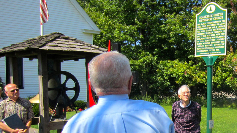 Gene Kerrick unveils and presents the Blakeslee United Methodist Church historical marker.