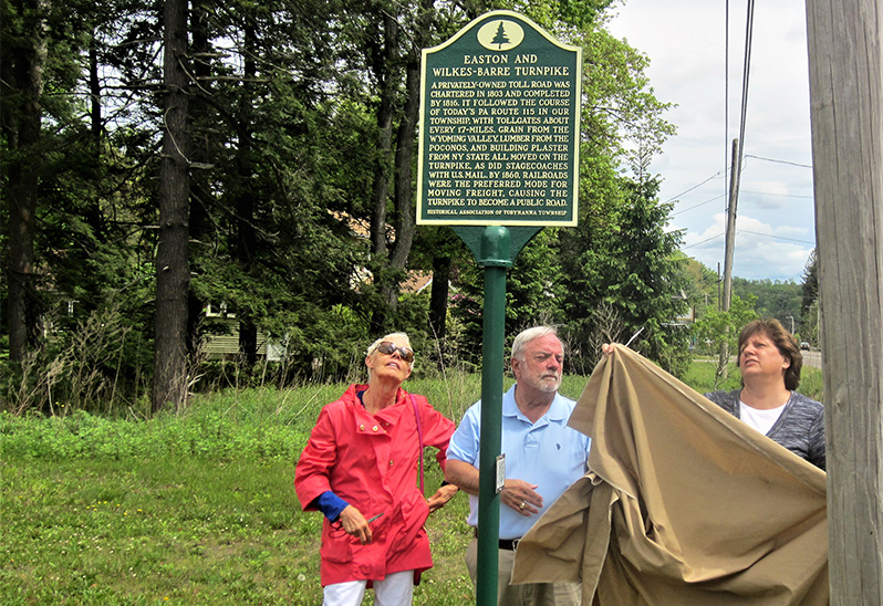 From left, Marge Brennan, Jerry Hanna and Kim Kerrick, all members ot the Historical Association of Tobyhanna Township, unveil the marker on May 27, 2017.