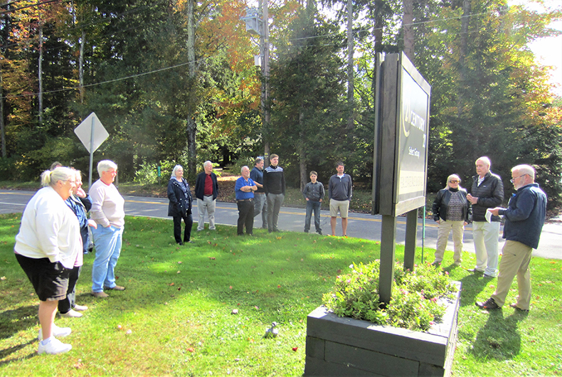 Bob Bossuyt, second from right, addresses the gathering.