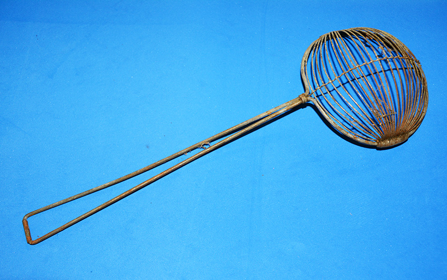 An early long-handled strainer