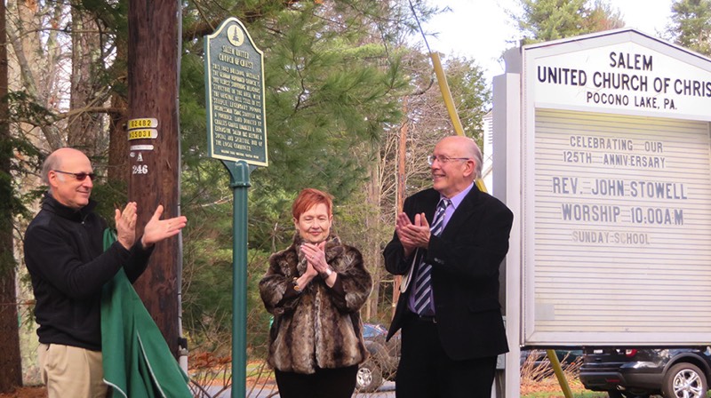 The marker is revealed by Dave Sleightholm, Salem UCC Consistory president; Marianne Hajduk, president of the Sullivan Trail Questers, and the Rev. John Stowell, pastor of UCC. (Bob Baechtold Photo)