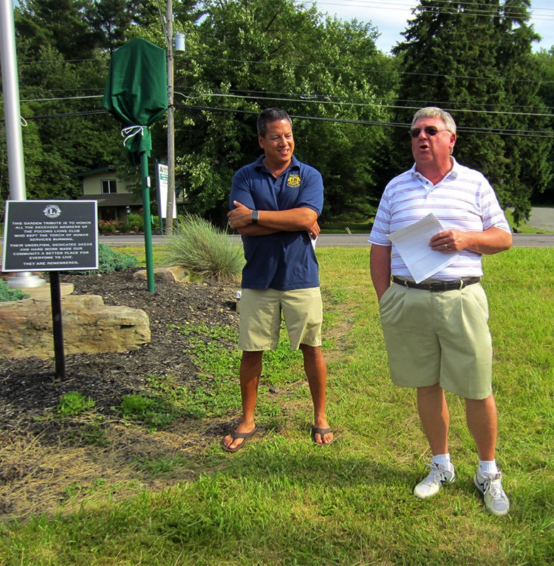 Rick Bodenschatz of MATT, right, welcomes Tobyhanna Township supervisors, state Rep. Jack Rader, and members of the Pocono Lions Club to the marker unveiling ceremony. At left is Pocono Lions President Sean Naughton.