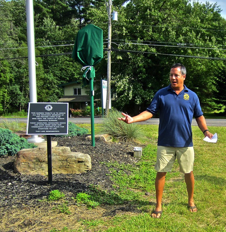 Sean Naughton, president of the Pocono Lions Club, shares the history of the club. The Tobyhanna Township historical marker was sponsored by the Pocono Lions, which also established the memorial garden where the marker was set.