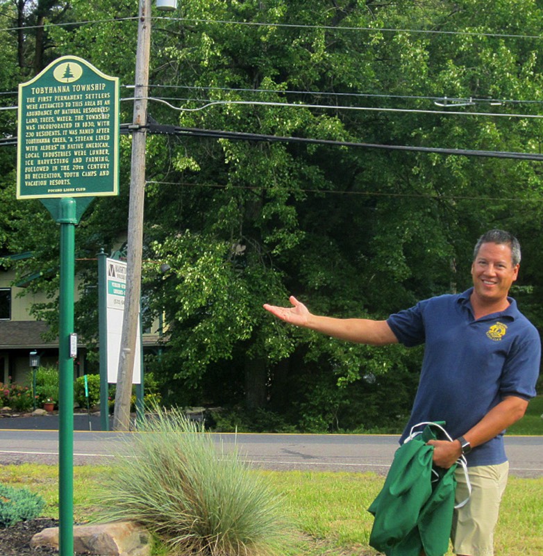 The Tobyhanna Township historical marker is unveiled by Pocono Lions Club President Sean Naughton.